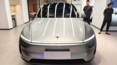 Tesla earnings slide despite record revenue